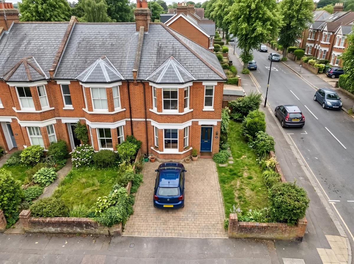 Aerial view of a one-car block-paving driveway at a terraced town house